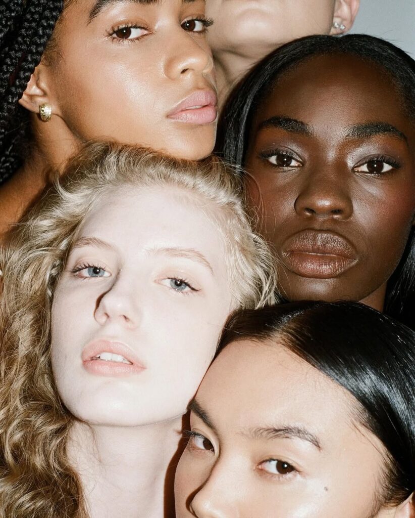 A diverse group of women standing in unity, symbolizing empowerment, advocacy, and visibility through The Collective Rising platform. Captured as a tribute to the network's legacy in championing women leaders and voices.