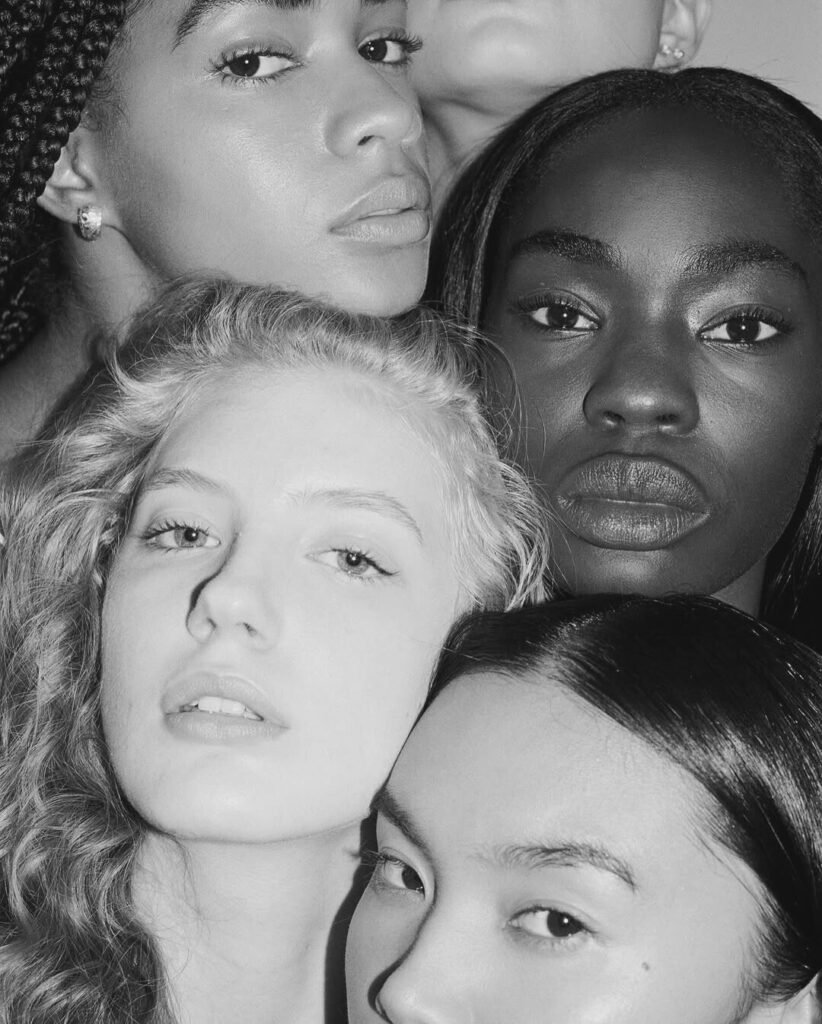 A diverse group of women standing in unity, symbolizing empowerment, advocacy, and visibility through The Collective Rising platform. Captured as a tribute to the network's legacy in championing women leaders and voices.